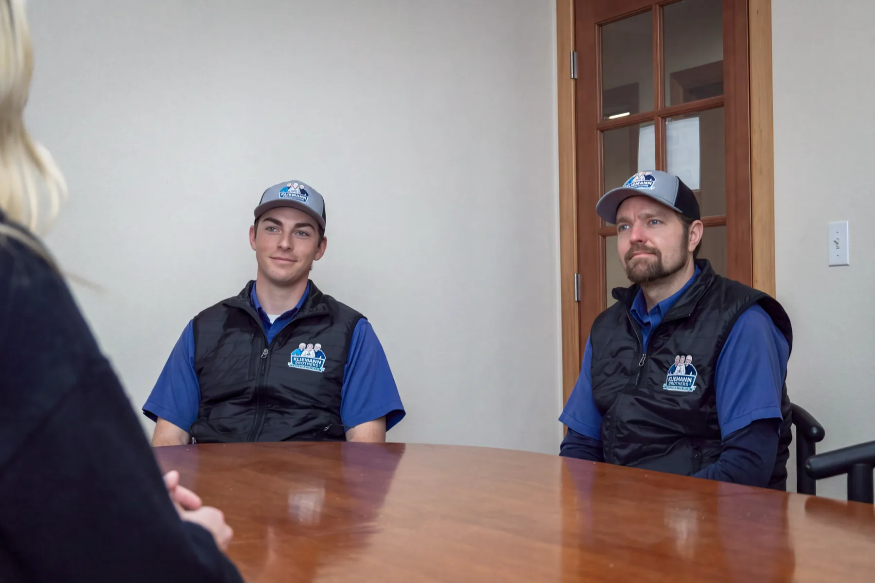Kliemann Brothers team members meeting with a homeowner