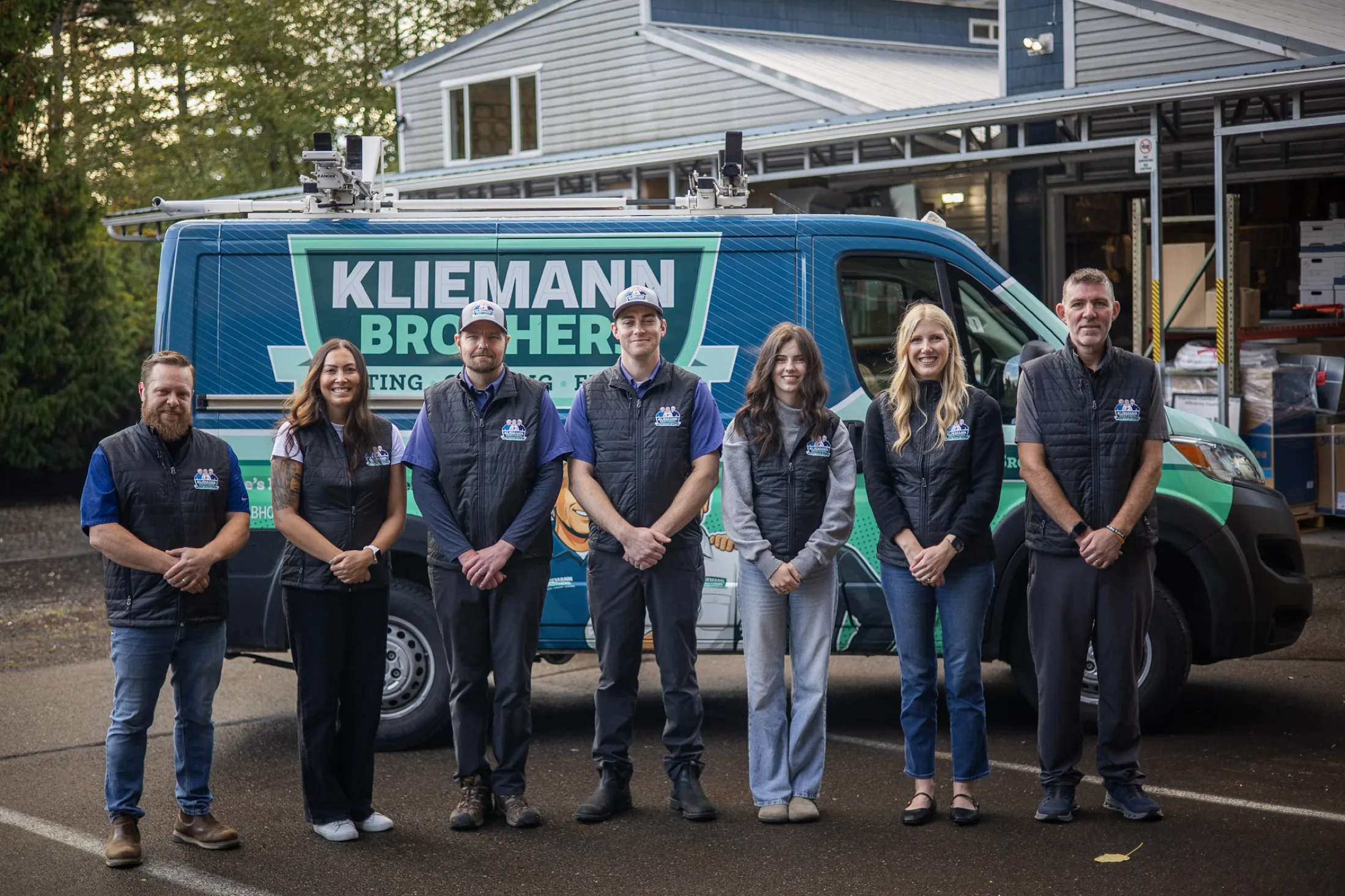 The Kliemann Brothers team in front of a branded service van