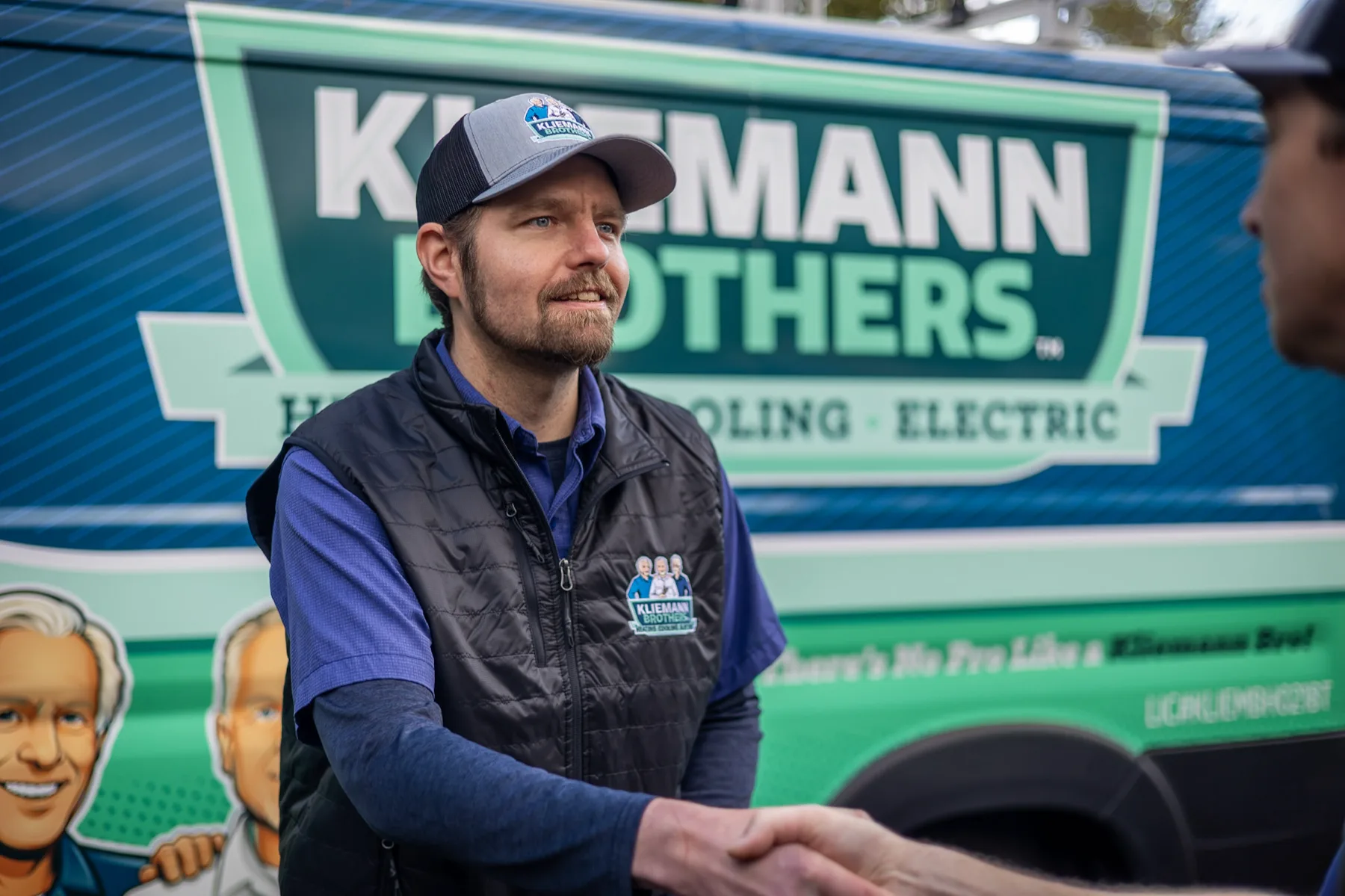 Kliemann Brothers technician shaking hands with a customer