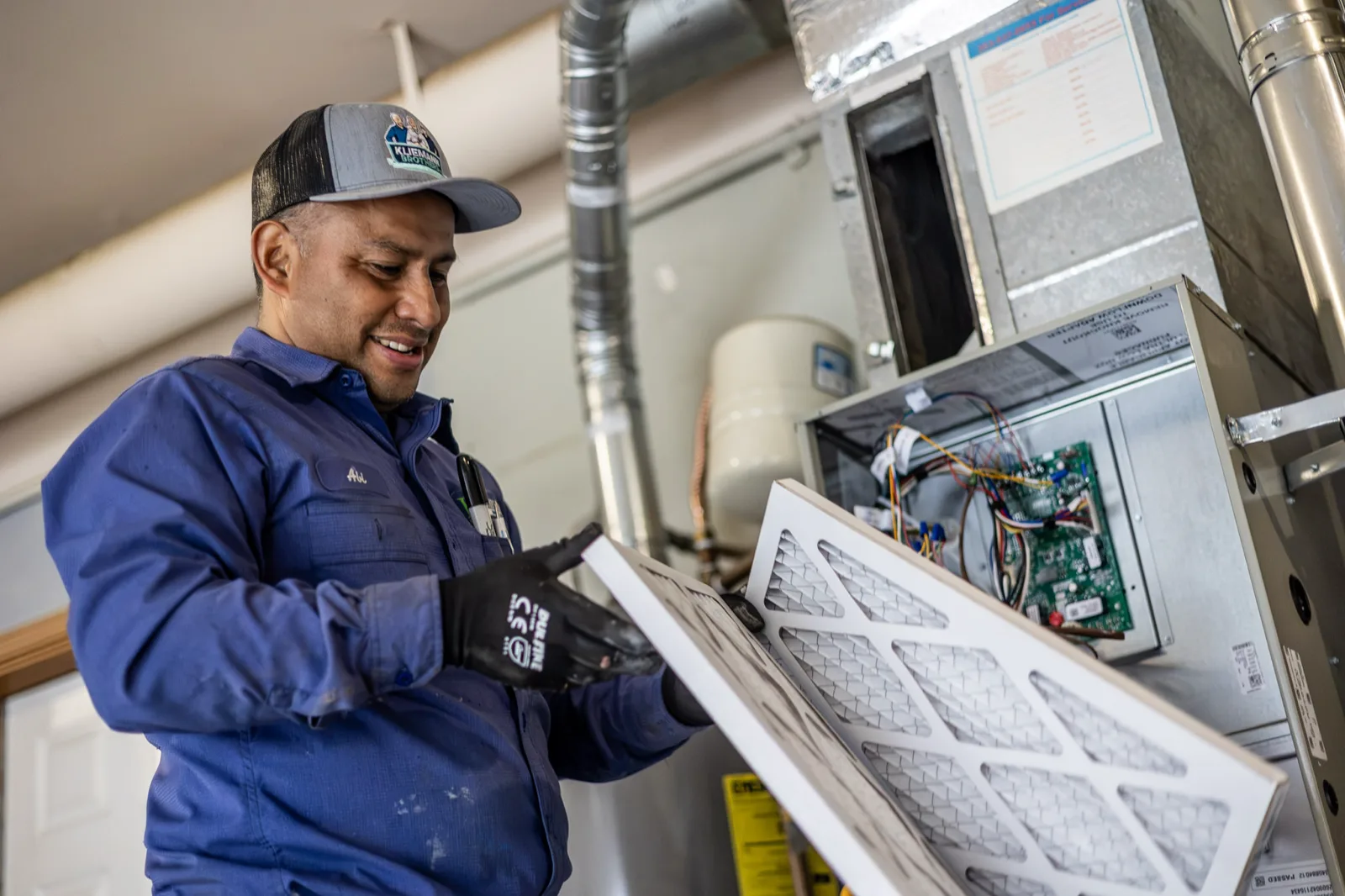Kliemann Brothers technician replacing an air filter