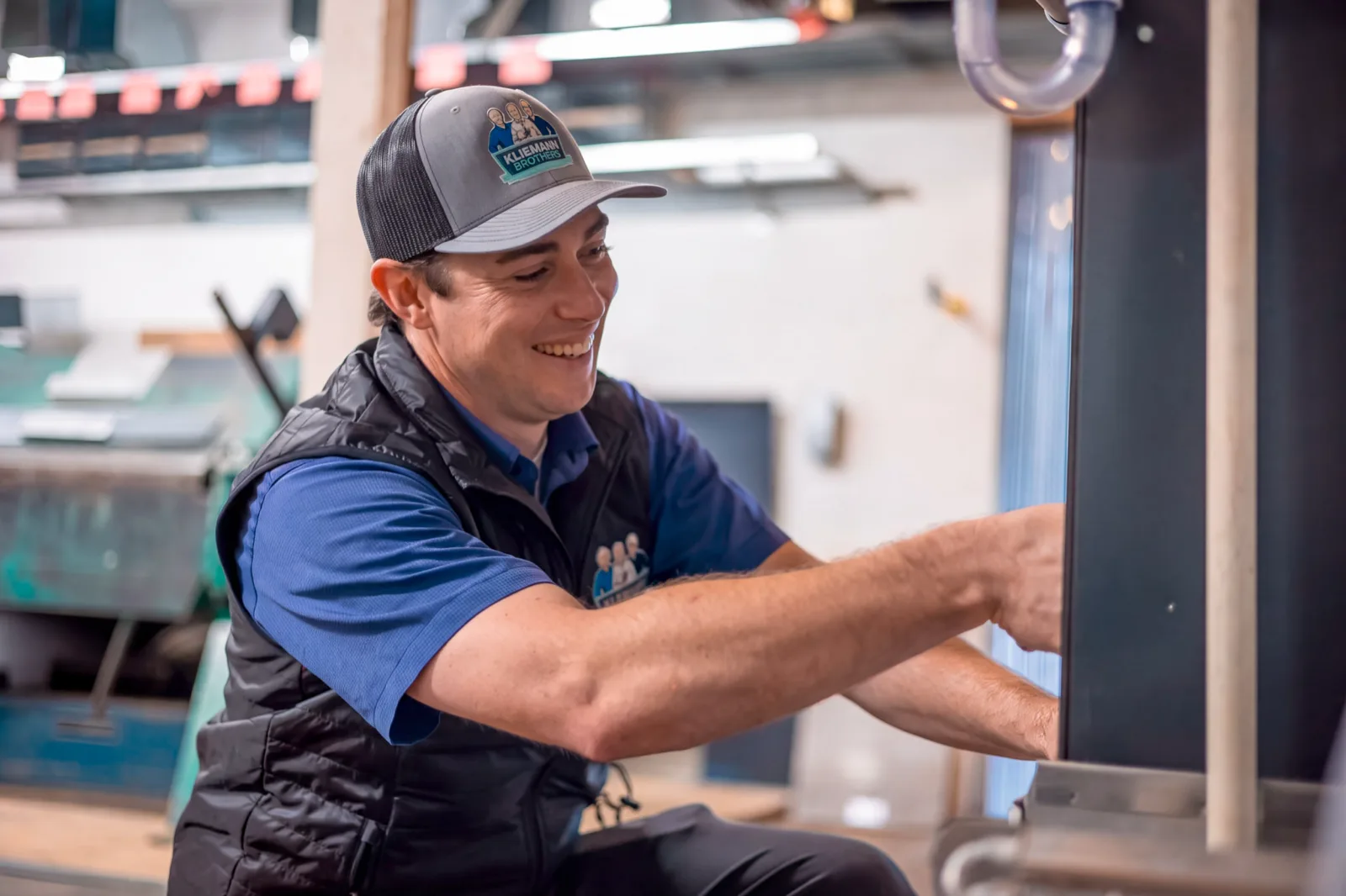 Kliemann Brothers technician performing an AC repair