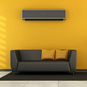 Living room utlizing ductless AC unit. Consider a ductless AC system.|Blue and brown modern office with fabric paneling with shelves and desk. The room does not exist in reality