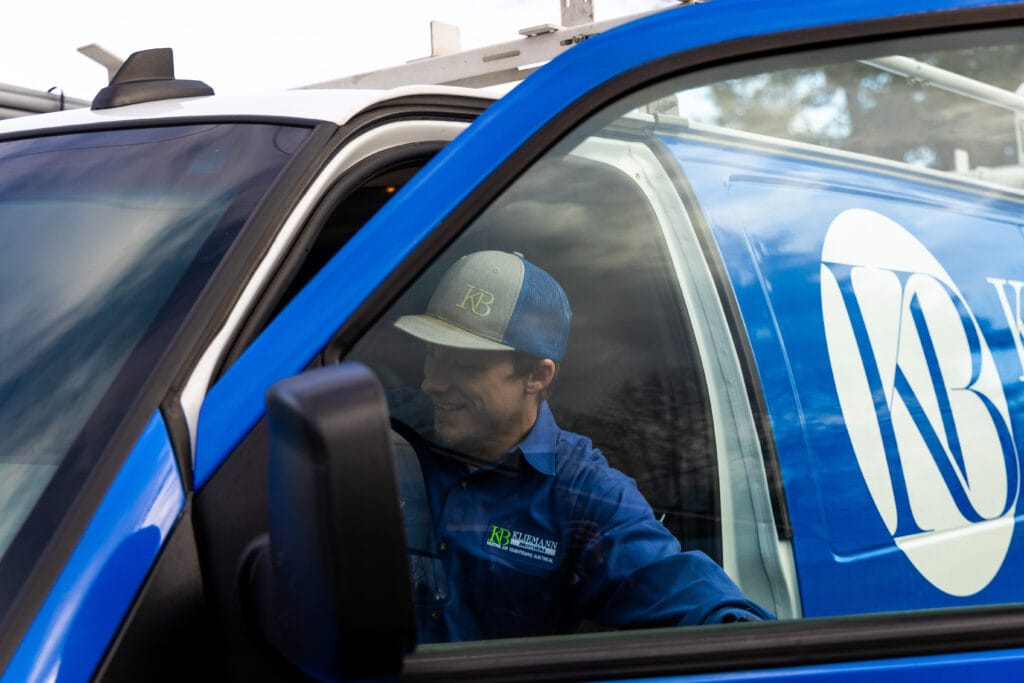 Kliemann technician getting out of the Kliemann van.