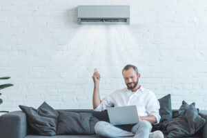 Video - Ductless Unit Benefits - Man sits on the couch.