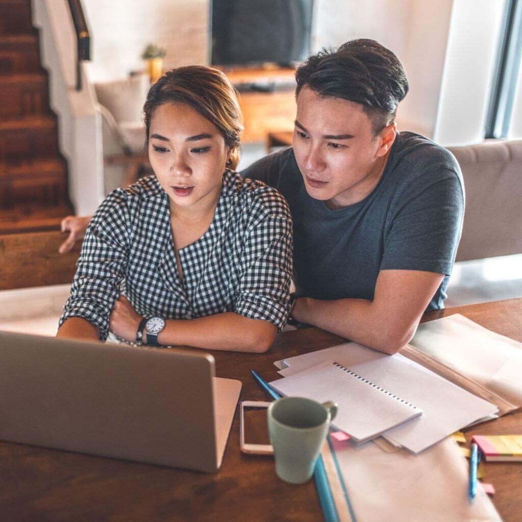 Couple looking at laptop.