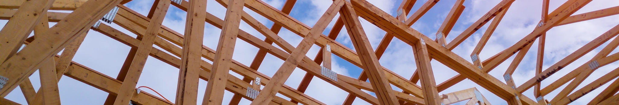 Residential construction home framing view on new house wooden under construction